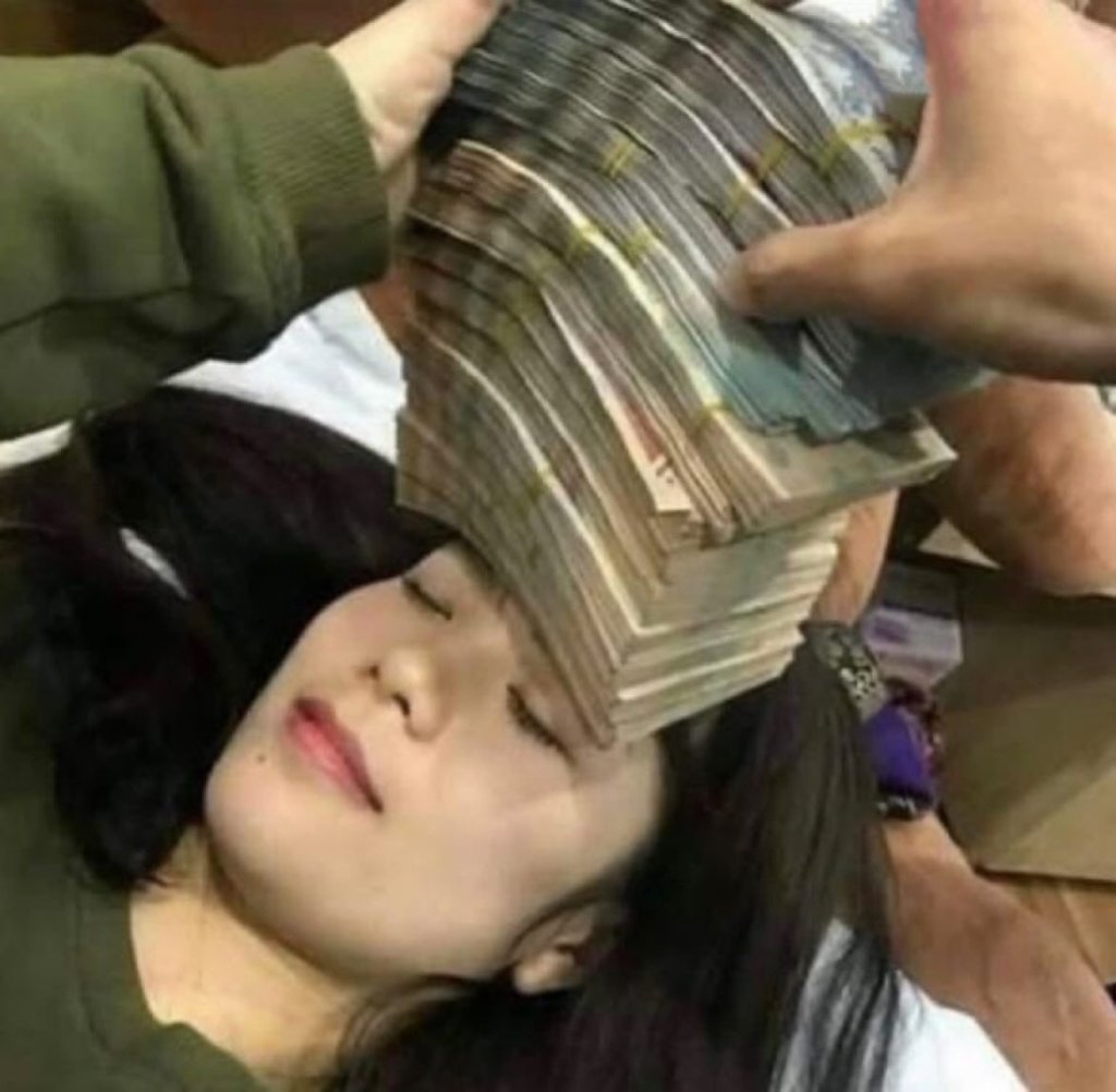 A woman with money on her head